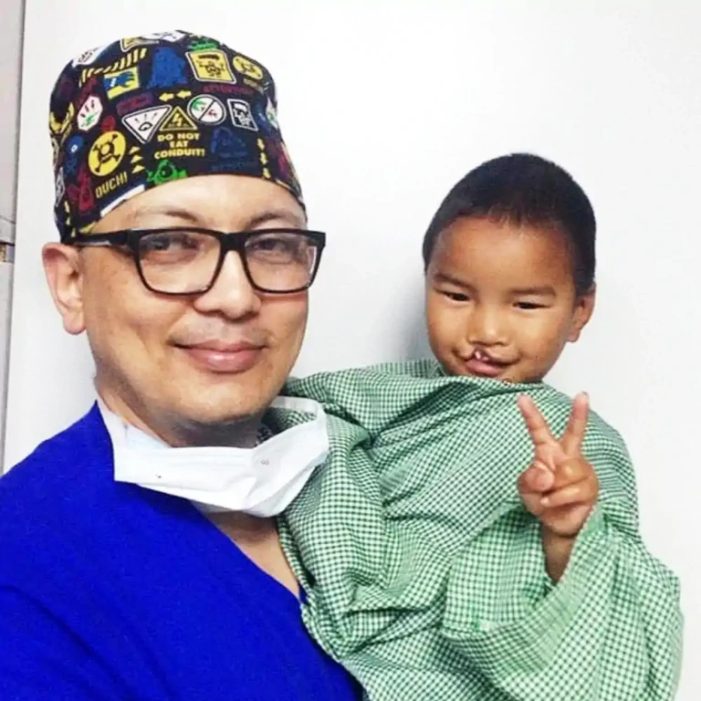 Dr. Rajib Khadka with a child